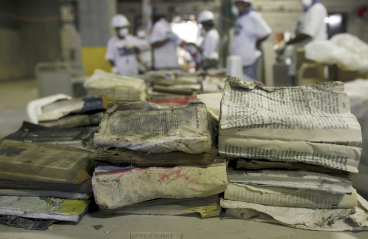 Recovery workers sort through books damaged by floodwaters at the Louisville Free Public Library's main downtown branch in 2009.