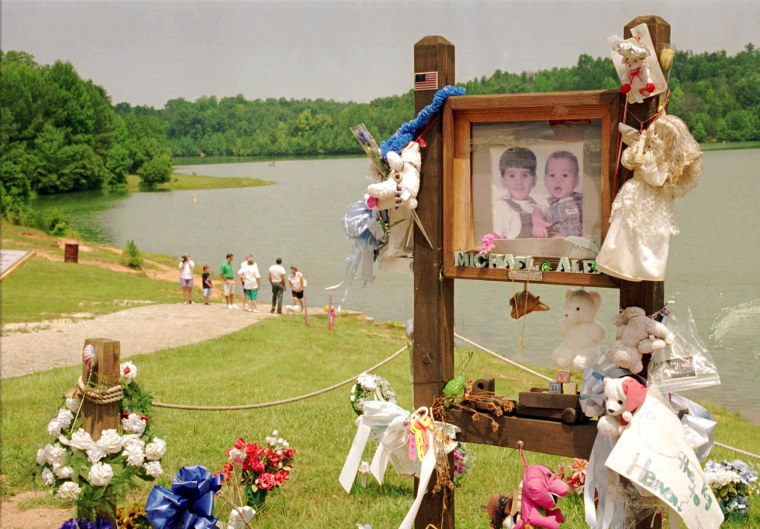 In a July 9, 1995 file photo, visitors walk down the ramp where Alex and Michael Smith were drowned in a car in 1994 in Union, S.C., by their mother, Susan Smith.