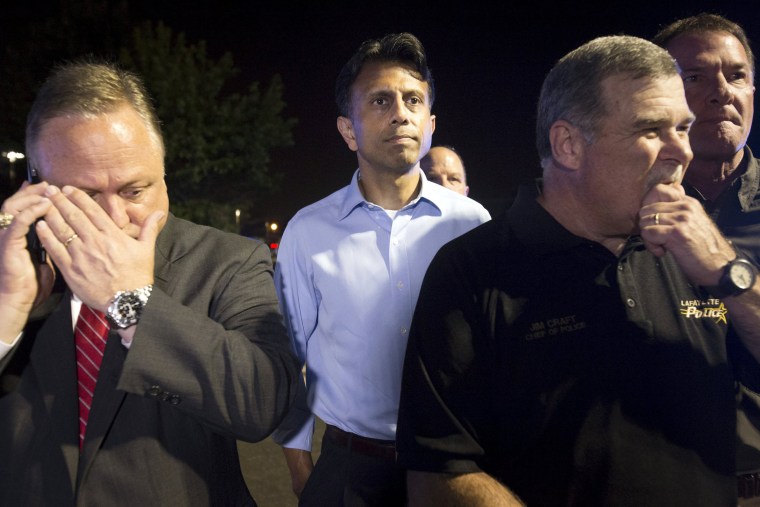 Image: Louisiana Governor Bobby Jindal prepares for a news conference outside the movie theatre where a man opened fire on film goers in Lafayette