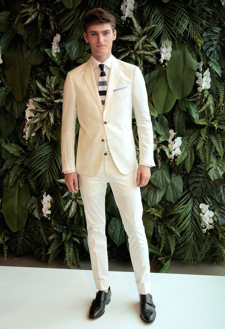 White Linen Suit - A model poses on the runway at the Tommy Hilfiger Spring 2016 Men's Tailored Collection presentation