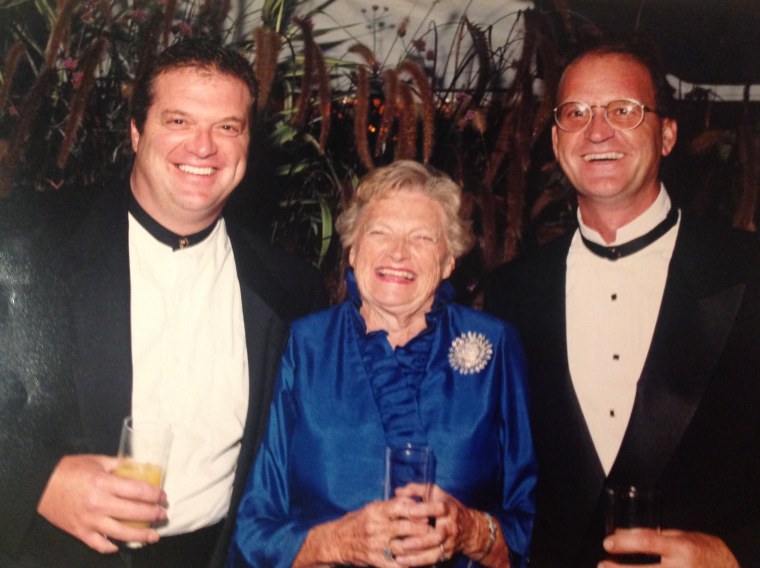 Mary Stocks laughs with two of her sons.