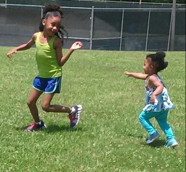 Girls running in the grass