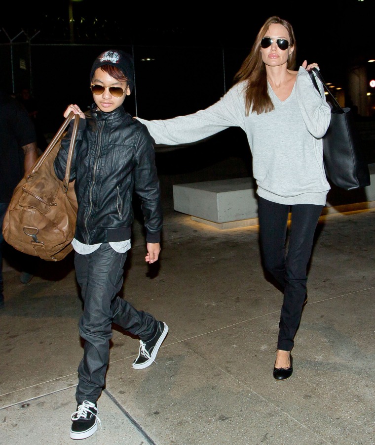 LOS ANGELES, CA - FEBRUARY 14: Maddox Jolie-Pitt and Angelina Jolie are seen at LAX airport on February 14, 2014 in Los Angeles, California.  (Photo by GVK/Bauer-Griffin/GC Images)