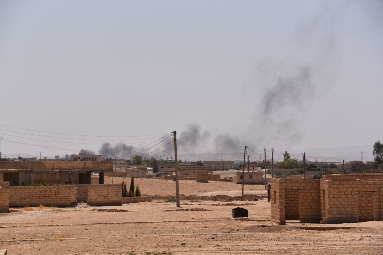 Image: Smoke rises over the battlefield in Hasakah, Syria.