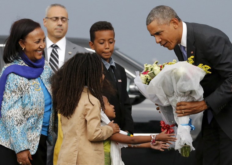 Image: Obama receives flowers from children in Ethiopia