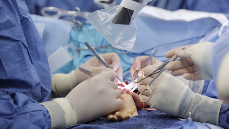 Image: Zion Harvey, 8, during his bilateral hand transplant surgery earlier this month.