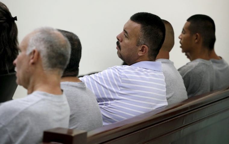 Image: Six men accused of the kidnapping and killing of 11 women listen to the verdict at a court room in the Mexican border city of Ciudad Juarez