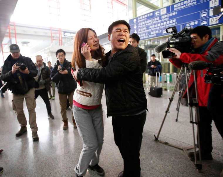 Image: Emotional woman at airport in Beijing on March 8, 2014