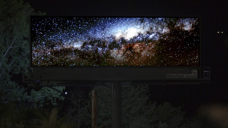 Artist Brian Kane changed the display of his digital billboards at night
