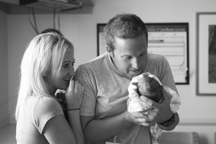 Dad gets to say his first hello to daughter Tilly.