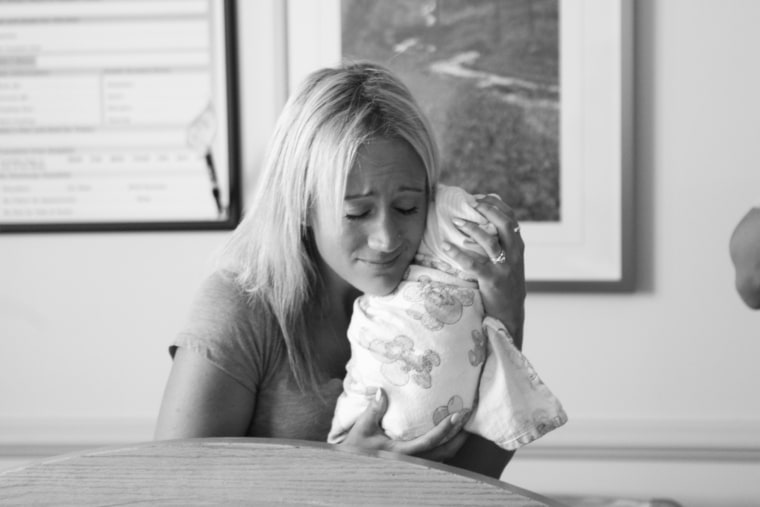 Sarah Olson holds her daughter, Tilly.