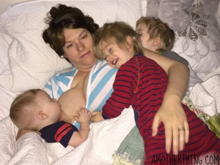 Mom breastfeeding in bed