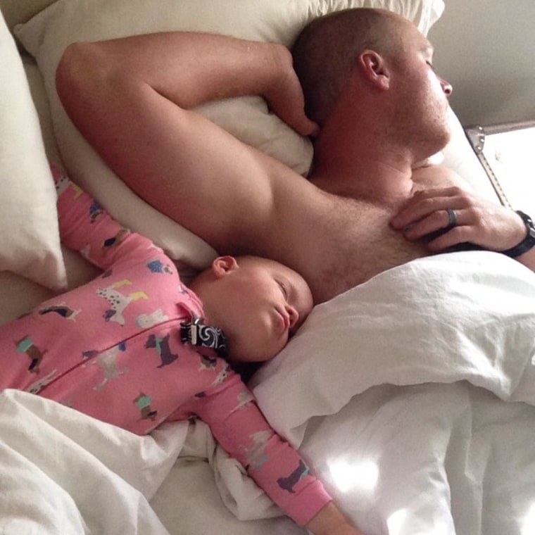 Toddler and dad in bed