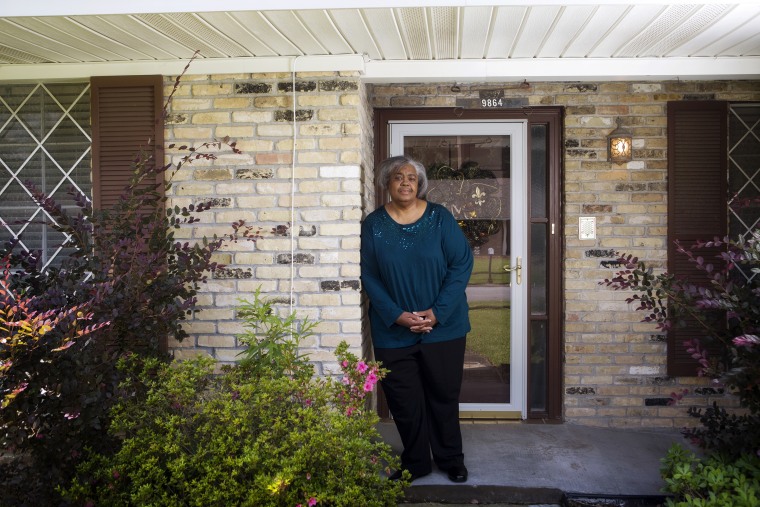 Mamie Mitchell stands outside her home which is across the street from the North Wastewater Treatment Plant in Baton Rouge.