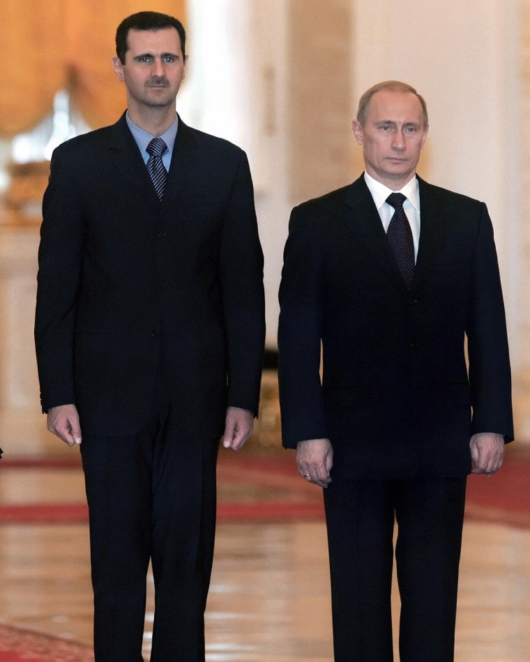 Image: Bashar Assad (R) and Vladimir Putin at the Kremlin in January 2005.