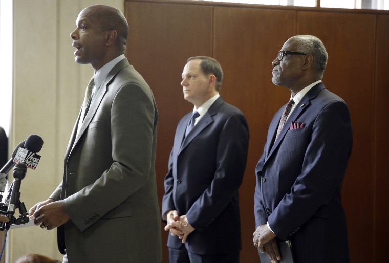 Missouri Department of Public Safety director Daniel Isom, left, spoke at November news conference on preparations for a grand jury's decision on whether to indict Darren Wilson.