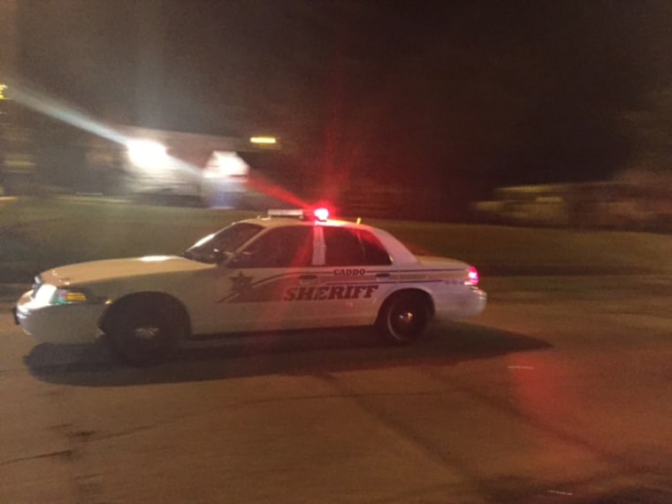 Image: Police at the scene of the shooting of a police office in Shreveport, Louisiana