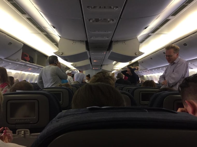 Image: Passengers aboard Flight UA935 on August 7, 2015