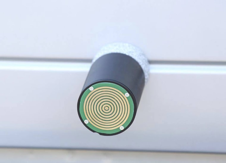 A device developed by StarChase of Virginia Beach propels a tracking device that looks like a cylindrical “bullet” with adhesive that can attach to the back of a moving vehicle.