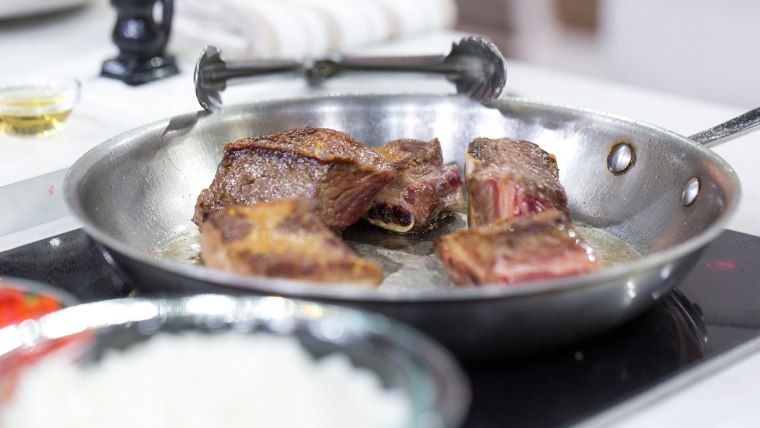 Cooking meat for slow-cooker feijoada, a classic Brazilian stew