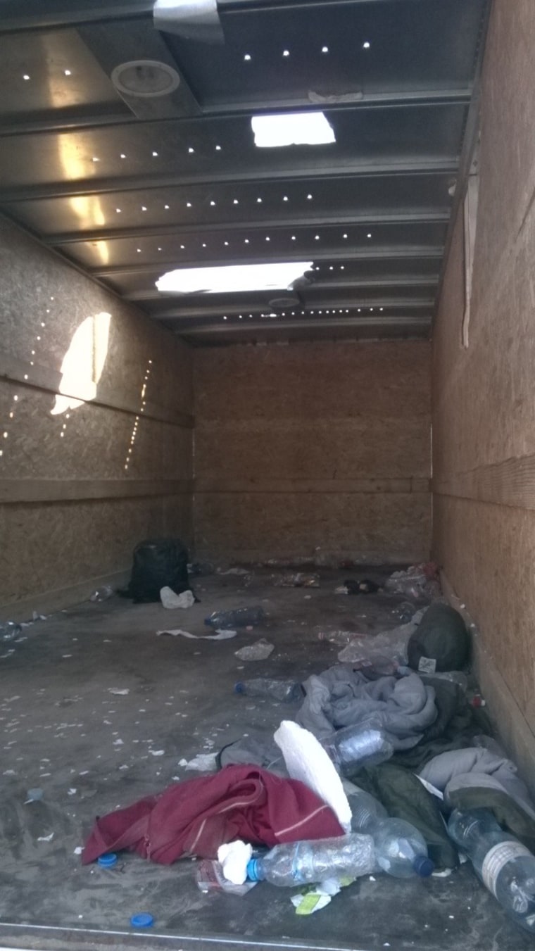 Image: Holes were torn in the truck's roof with the migrants' bare hands