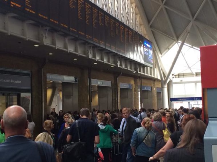 Sea of people stuck at #KingsCross due to a "security incident". Platforms closed and lots of armed police!