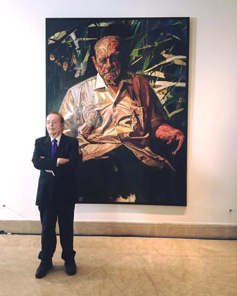 Puerto Rican artist Francisco Rodón stand in front of the portrait he painted of Luis Muñoz Marín, the father of modern Puerto Rico and first democratically elected governor of the island. The portrait was unveiled at the National Portrait Gallery in Washington, D.C. Aug. 13, 2015.