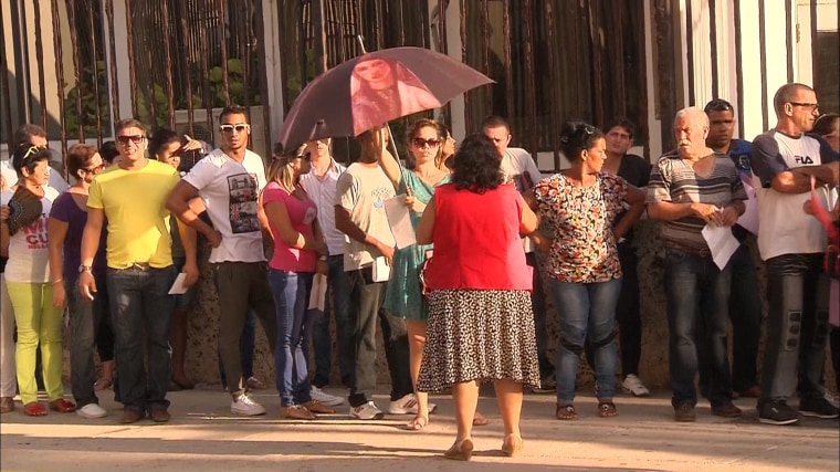 Cubans wait in line at the U.S. Embassy in Havana in August 2015 for visas. 