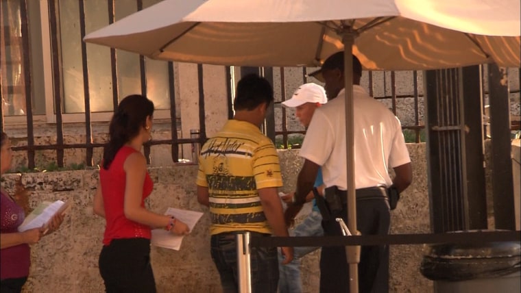 Cubans wait in line at the U.S. Embassy in Havana for visas.