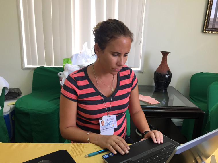 Caption: Havana TV producer Odalys Garcia, 38, says she got emotional watching the U.S. flag-raising ceremony because she realized her son, born 8 months ago, "was born in a new era."