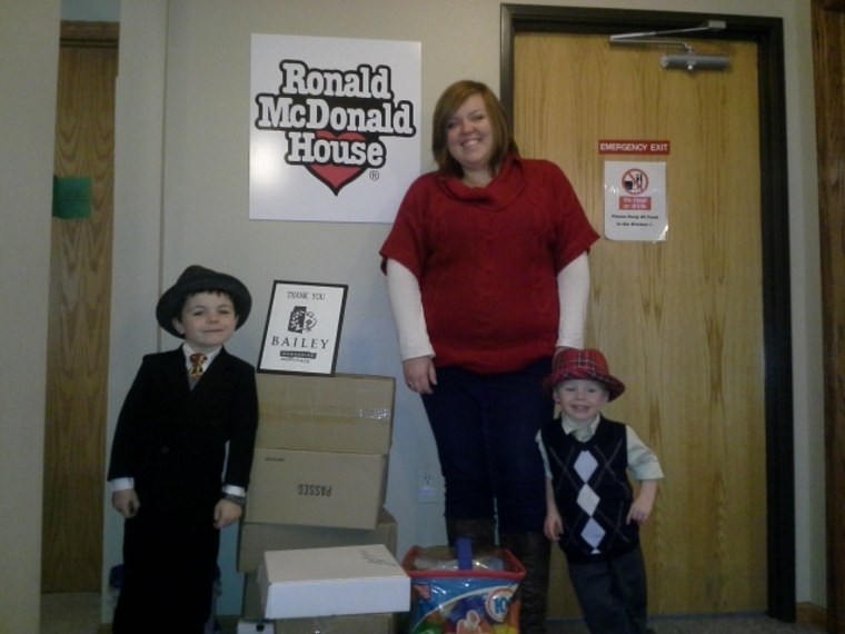 James Tufts poses with his brother and former mayor Robert Tufts as they visit with a Ronald McDonald House volunteer during Bobby's time as mayor.