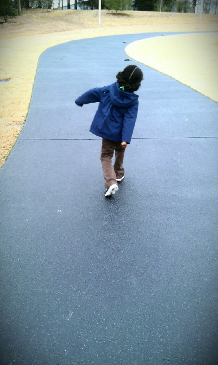 Girl walking off to kindergarten by herself