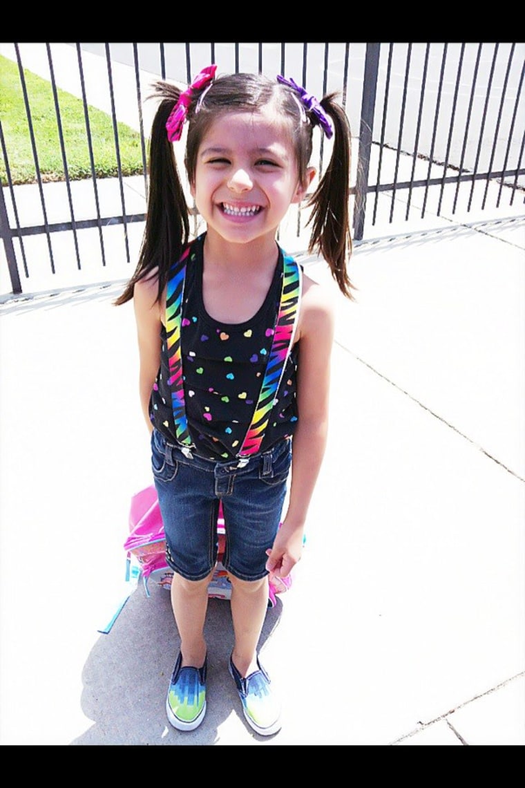 Girl smiling and wearing pigtails