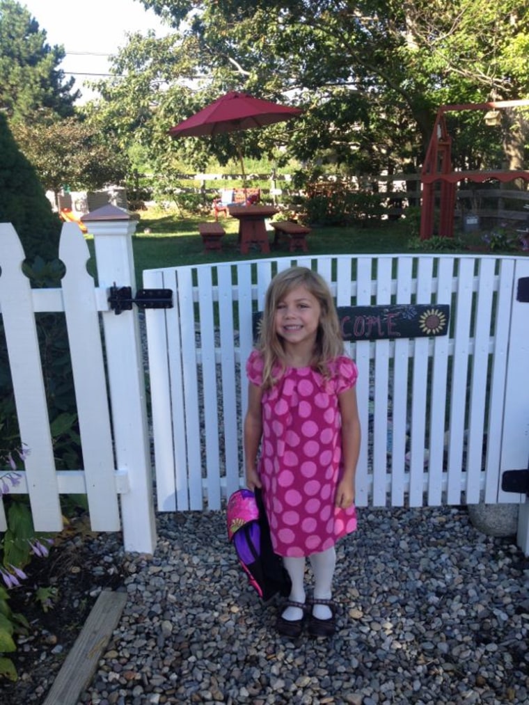 Girl smiling on first day of school