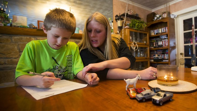 Mom helps son with homework