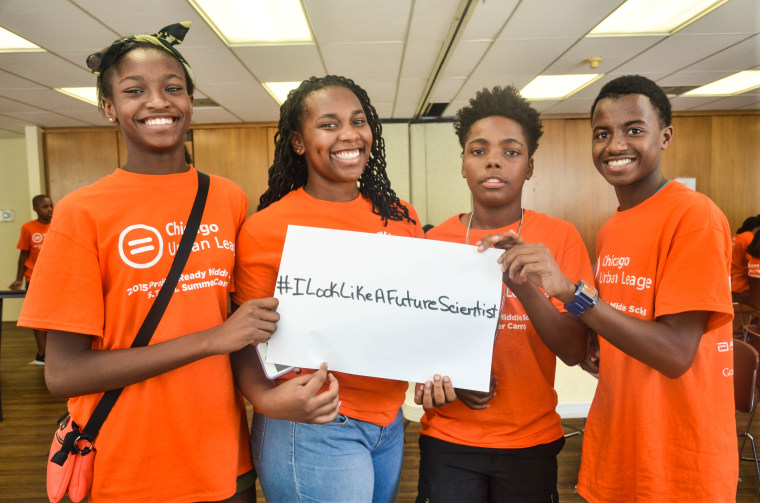 Chicago Urban League Stem Camp participants hold up a sign with the hashtag #ILookLikeAFutureScientist to promote diversity in the fields of science. The STEM camp brings students as young as fourth grade to Abbott facilities so they can see science and engineering in action.