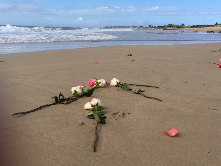 Image: Flowers on the beach where Reeva Steenkamp's ashes were scattered