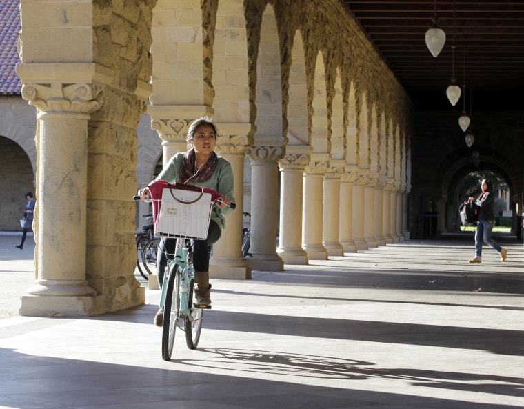 A Stanford University student bikes her way through the halls on the Stanford University