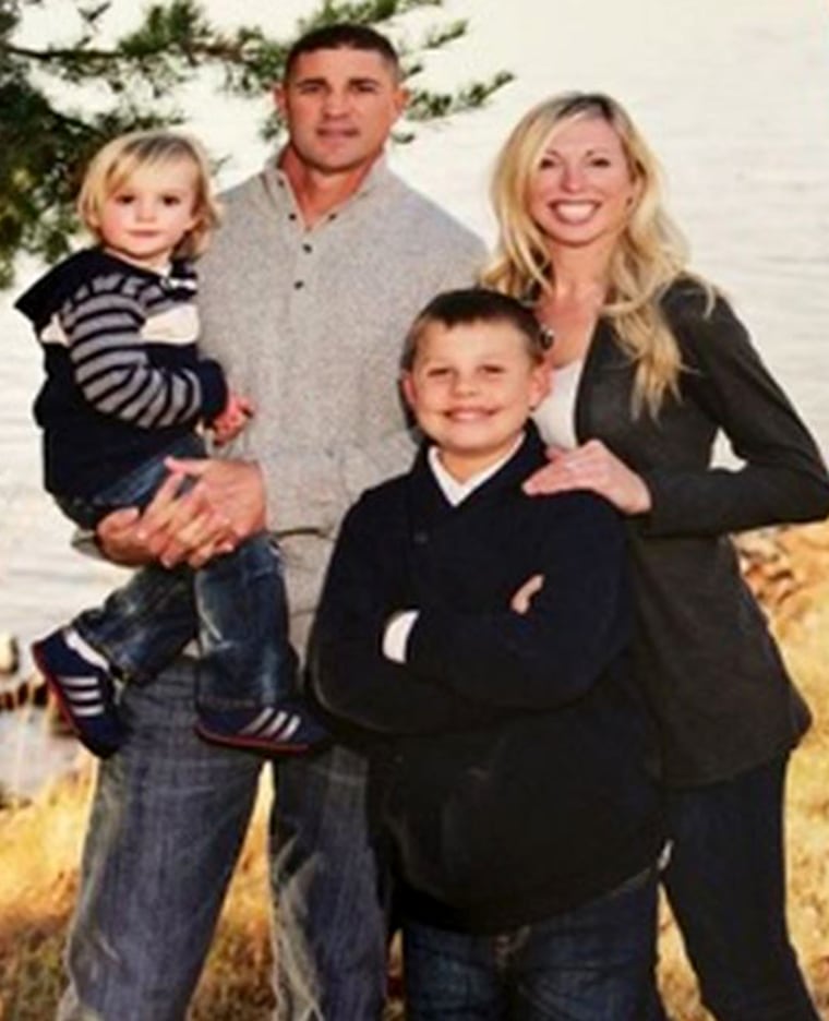 Darren and Amber Schmolke, with children Eli, 3, and Luke, 11.