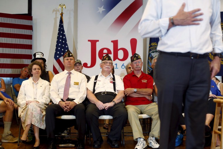 Image: Audience members listen as former Florida Governor and Republican candidate for president Jeb Bush speaks at a VFW town hall event in Merrimack