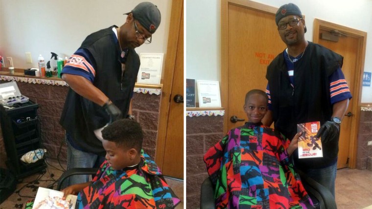 Barber Courtney Holmes, who gave away free haircuts to children in exchange for them reading him stories at a community back to school festival last weekend.