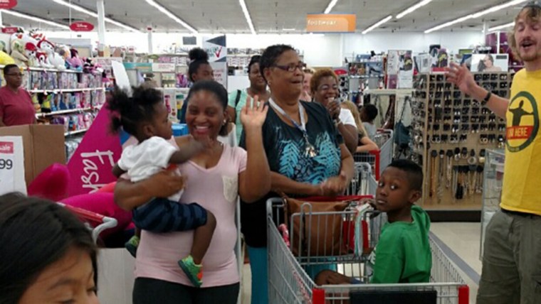 Parents and kids celebrate after learning that their layaway balances would be paid off.