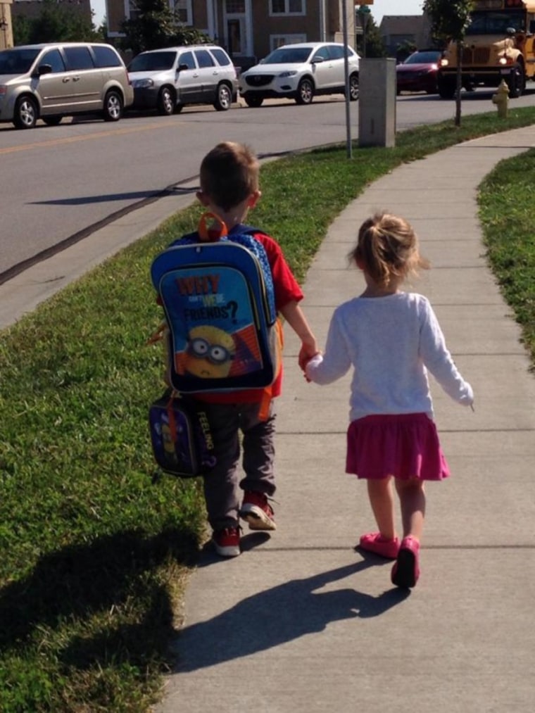 Small children walking off to school