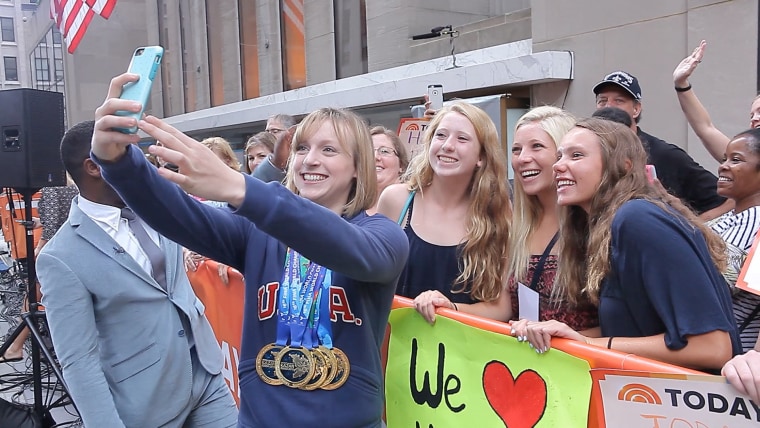 USA Swimming’s Katie Ledecky takes a selfie with fans on the TODAY Show plaza.