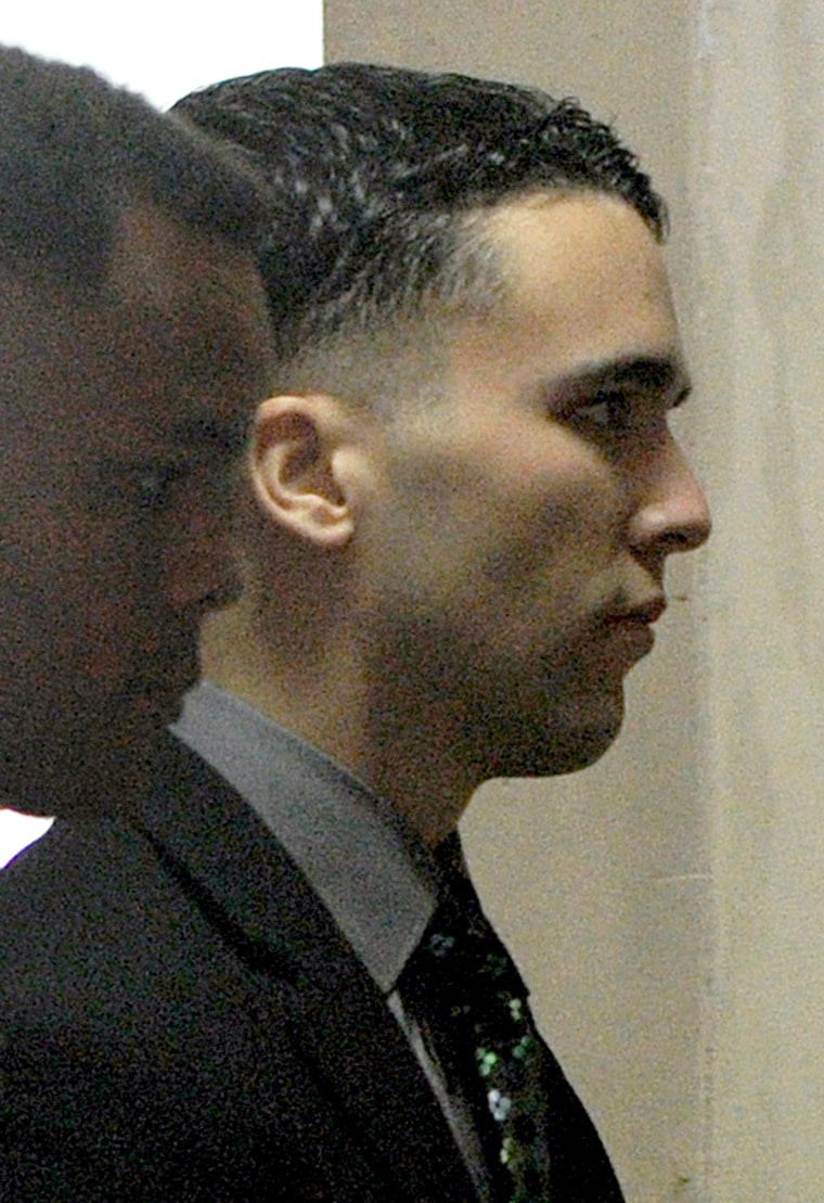 Image:  US Marine Private First Class Joseph Scott Pemberton (R) entering a court building to face the first day of his trial for the murder of transgender Filipina