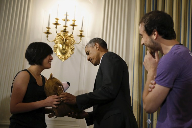 Image: President Obama meets Chung and Horowitz of Sproutel as he views exhibits at the White House Demo Day at the White House in Washington