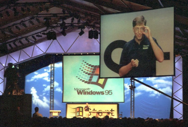 Image: Microsoft Chairman Bill Gates is televised on a big screen as he introduces Windows 95