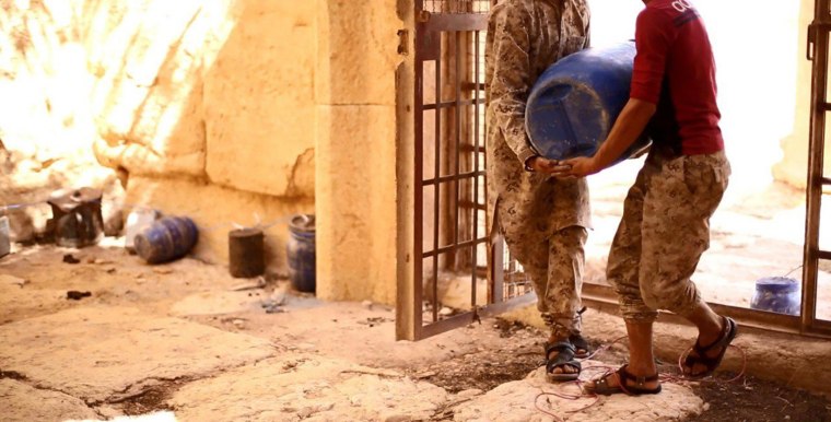 Image: ISIS image appears to show militants carrying a bomb into the Baal Shamin temple