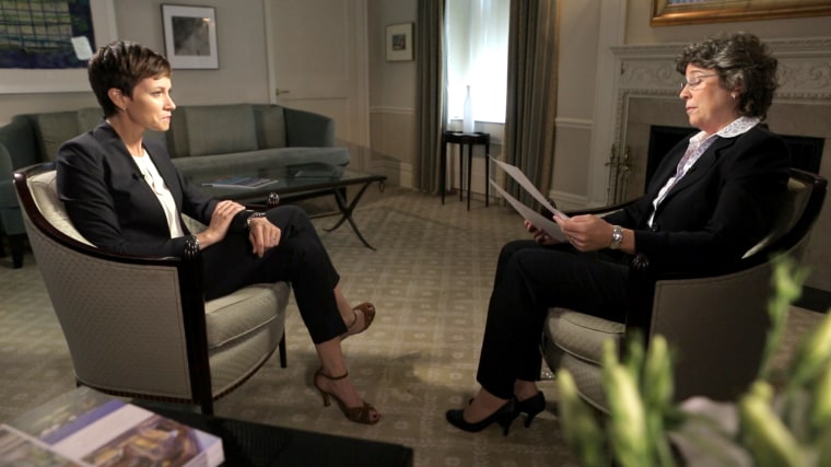 Kay Fuller, a former insider at C.R. Bard, examines a signature on an FDA application for the Recovery blood-clot filter during an interview with NBC News correspondent Stephanie Gosk.