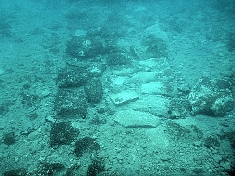 The remains of a wall or street in the sunken village.